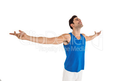 Excited male athlete with arms outstretched