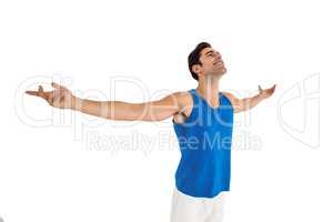 Excited male athlete with arms outstretched