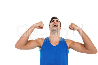 Excited male athlete posing after victory