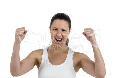 Excited female athlete posing after victory