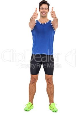 Portrait of confident athlete smiling and showing thumbs up