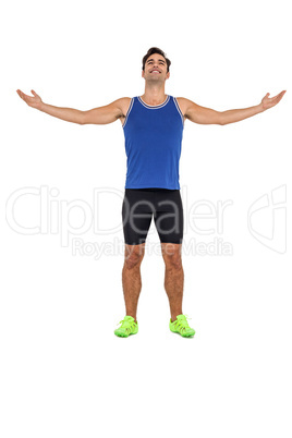 Athlete man standing with arms outstretched