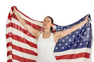 Female athlete posing with american flag