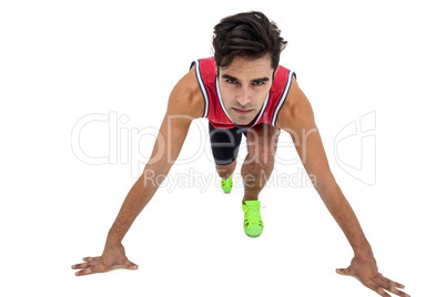 Portrait of male athlete in ready to run position