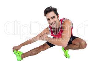 Portrait of male athlete stretching his hamstring