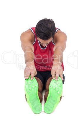 Male athlete doing stretching exercise