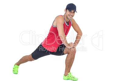 Portrait of male athlete doing stretching exercise