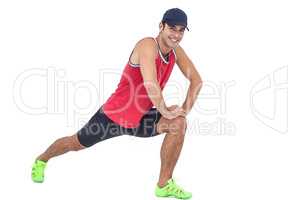 Portrait of male athlete doing stretching exercise