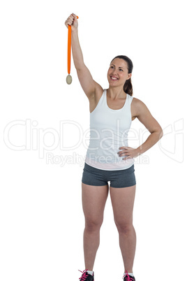 Happy athlete woman holding gold medals after victory