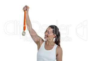 Happy athlete woman holding gold medals after victory