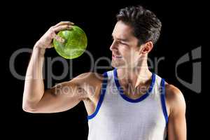 Happy male athlete holding a ball