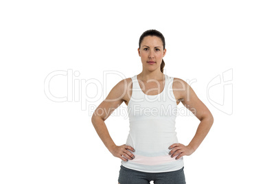 Portrait of female athlete standing with hands on hips Portrait of female athlete standing with hands on hips