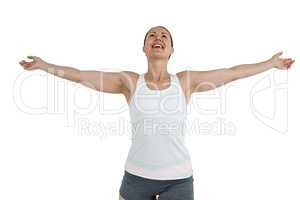 Female athlete standing with arms outstretched