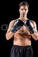 Portrait of boxer standing with boxing gloves