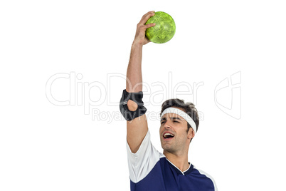 Sportsman holding a ball on white background