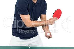 Mid section of athlete man playing table tennis