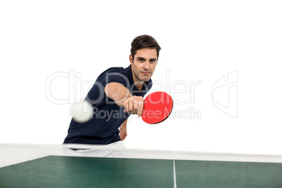 Portrait of male athlete playing table tennis