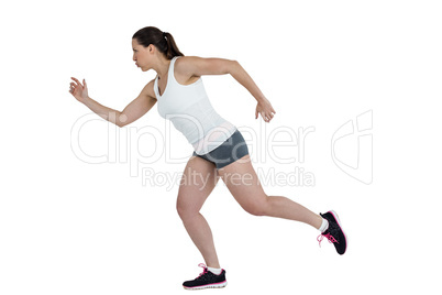 Side view of energetic female athlete running