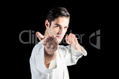 Portrait of fighter performing karate stance