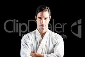 Portrait of fighter standing on black background