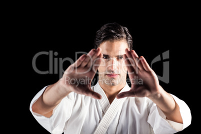 Portrait of fighter performing karate stance