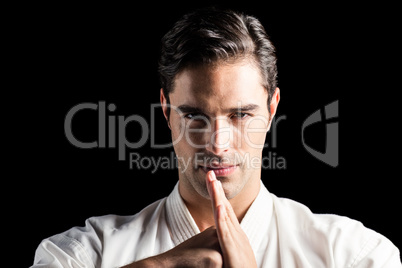 Portrait of fighter performing hand salute