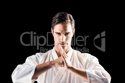 Portrait of fighter performing hand salute