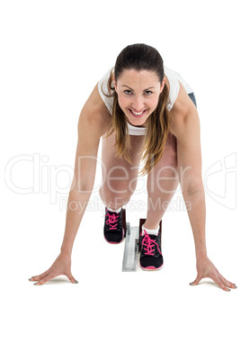 Portrait of athlete woman in ready to run position