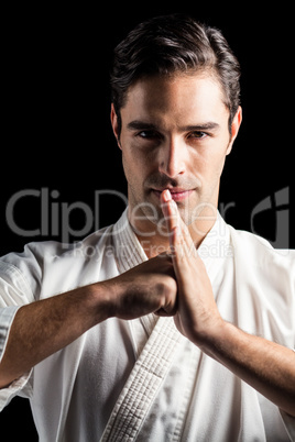 Portrait of fighter performing hand salute