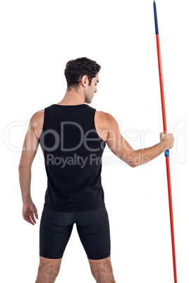 Rear view of male athlete holding javelin