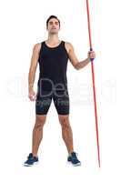 Confident male athlete holding javelin