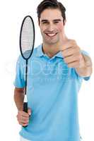 Portrait of badminton player showing thumbs up