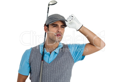 Golf player posing with golf club