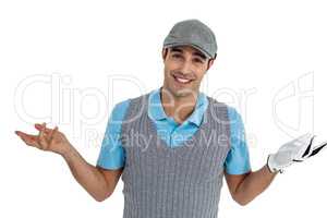 Confident golf player posing on white background