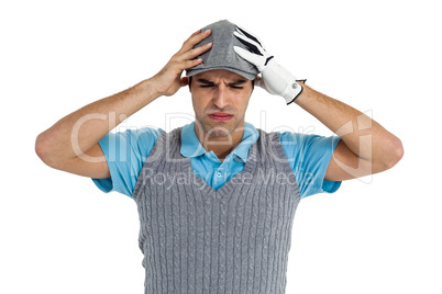 Frustrated golf player standing on white background