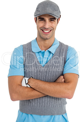 Golf player standing with arms crossed