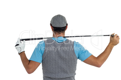 Rear view of golf player holding a golf club