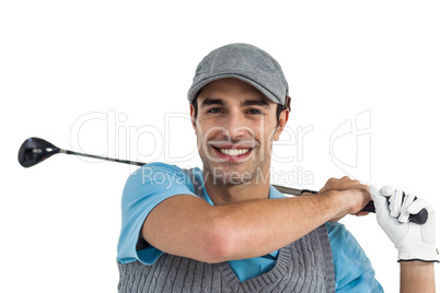 Portrait of golf player taking a shot