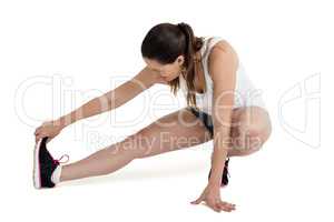 Athlete woman stretching her hamstring