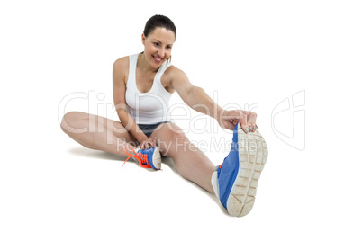 Athlete woman stretching her hamstring