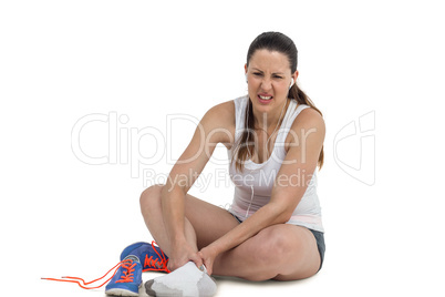 Athlete woman with foot pain on white background
