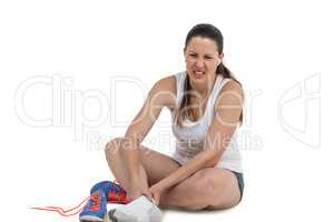 Athlete woman with foot pain on white background