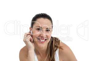 Athlete woman listening to music on headphone