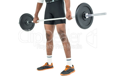 Mid-section of bodybuilder lifting heavy barbell weights