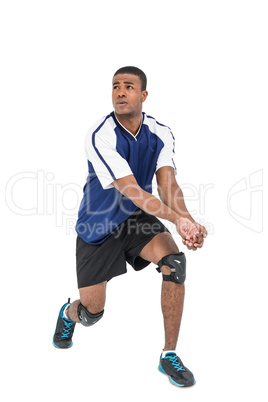 Sportsman posing while playing volleyball