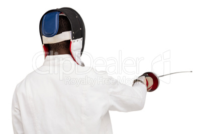 Rear view of man wearing fencing suit practicing with sword