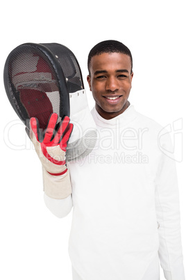Swordsman holding fencing mask