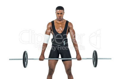 Bodybuilder lifting heavy barbell weights