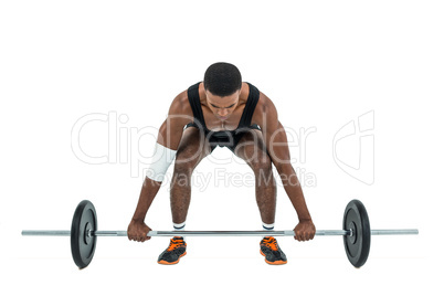 Bodybuilder lifting heavy barbell weights