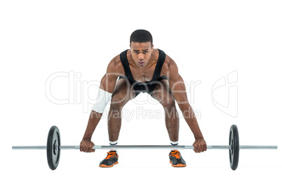 Bodybuilder lifting heavy barbell weights